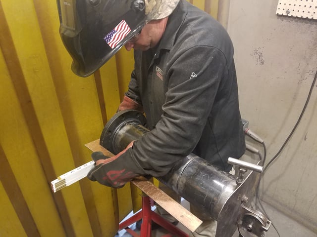 Chris Barnett gains hands-on welding experience through the UA VIP Program at JBLM