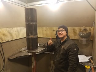 Mark Torres shows his welding project for the UA VIP JBLM Welding Program