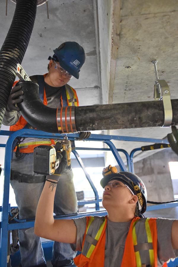 UA VIP students learn sprinkler fitting skills, which can save lives